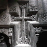 Монастырь  Гегард, армянский крест и другие барельефы, вырезанные в скале.